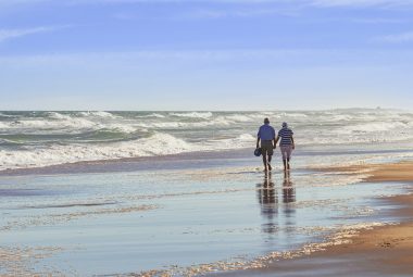 Older couple on beach. This closeness is what a mature woman wants in a relationship